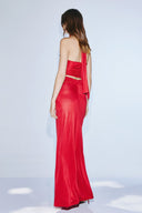 A long evening dress made from textured satin in a mustard colour.